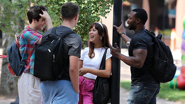 Group of students chatting in Fountain Square