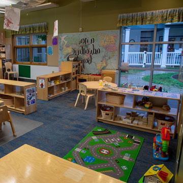 Toddler Classroom, showing the different learning areas including dramatic play, blocks, and child cubbies. 